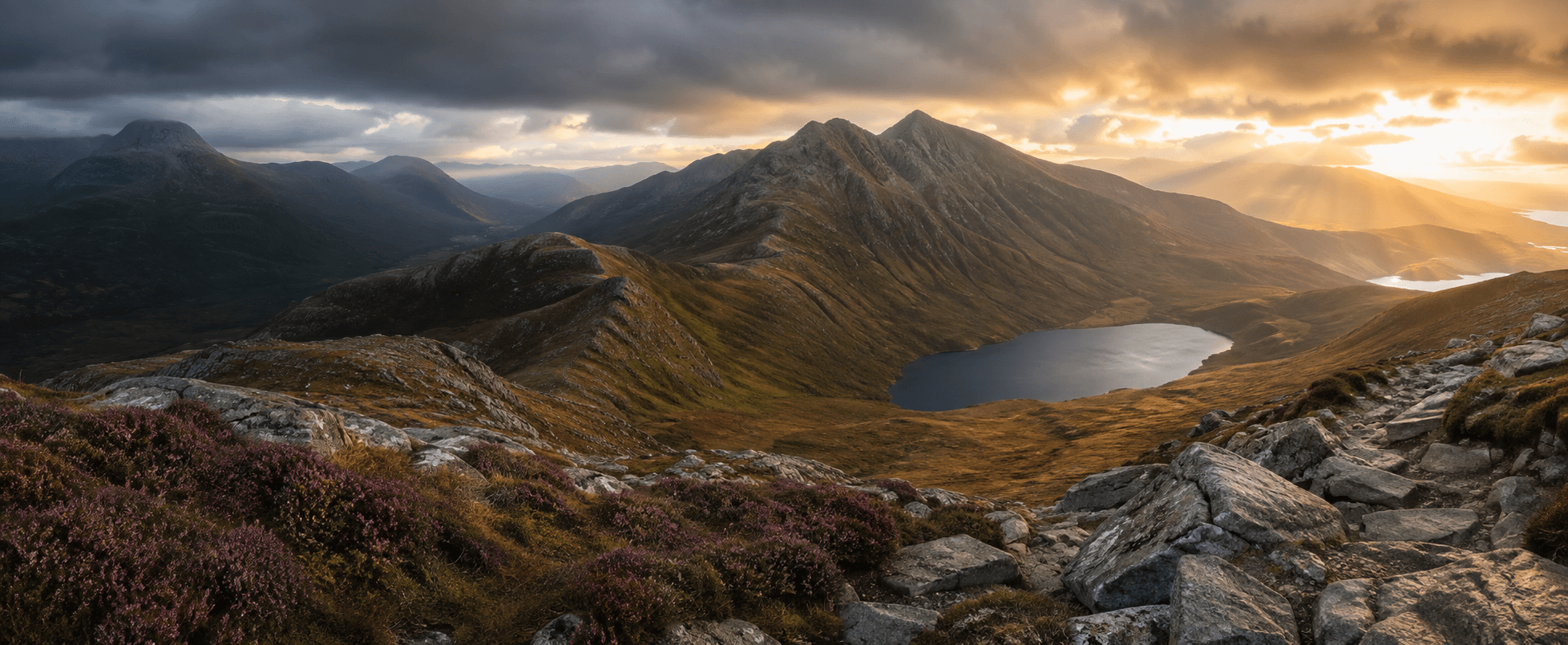 Scottish Highland Munro ridges and a lochan at sunrise