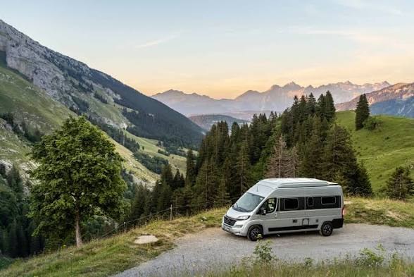 A campervan touring through open countryside