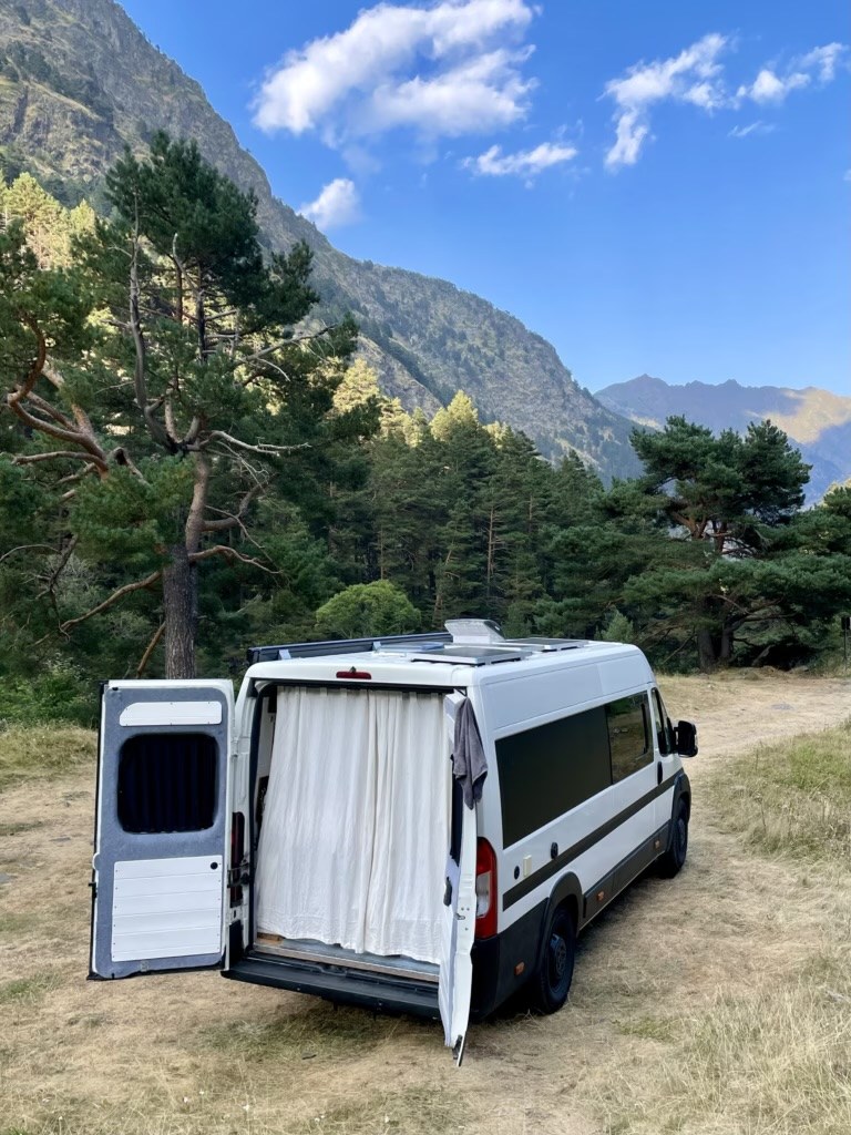 A CampaMate campervan with its rear doors open ready for a trip